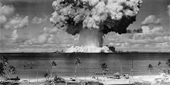 (NUCLEAR TESTING--BIKINI ATOLL) Mini-archive with 13 rare photographs illustrating the immense power of the Bikini Atoll atomic bomb te